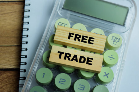Concept of text free trade on wooden blocks. For global economics and commerce