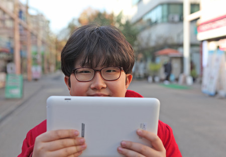Children studying with a tabletの写真素材