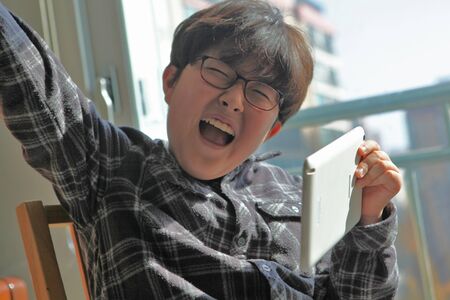 Elementary school students happy to study the tabletの写真素材