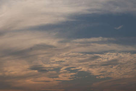 Orange and blue clouds unite in the afternoonの写真素材