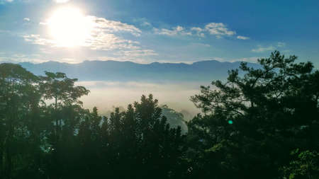 Watching the sunrise over the East Rift Valley in Hualien, Taiwan.  As the sun rises over the...