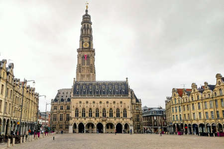 Town square of Arras, France. UNESCO World Heritage Site, Belfry of Arras, standing tall against a...