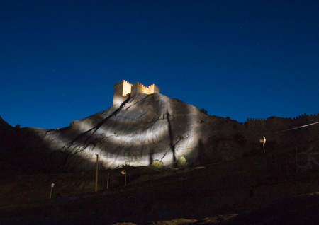 Genoese fortress illuminated in the mountains at night in Crimea.の写真素材