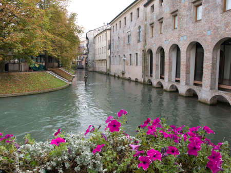 TREVISO, ITALY - SEPTEMBER 29,2014 - Mermaid sculpture on a canal in Treviso in Italy.のeditorial素材