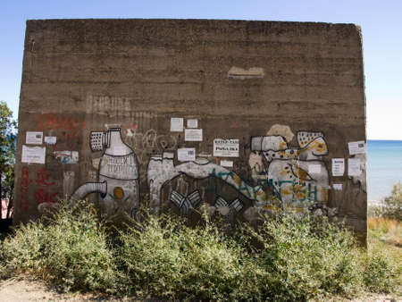 KURORTNOE, UKRAINE - SEPTEMBER 10,2012 - Wall with graffiti near the seaのeditorial素材
