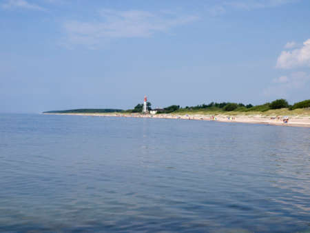 Beach and lighthouse on the shores of the Baltic Sea.の写真素材
