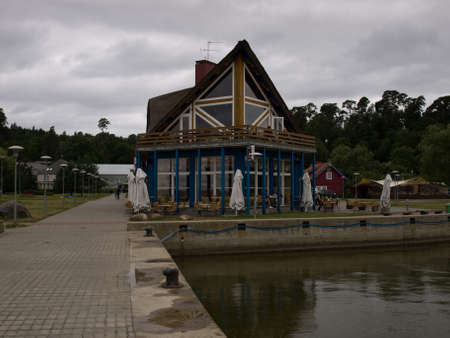 Juodkrante, Lithuania - July 25, 2010 - Cafe on the embankment of the resort village.のeditorial素材