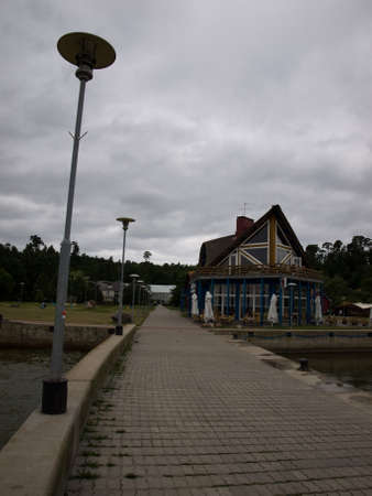 Juodkrante, Lithuania - July 25, 2010 - Cafe on the embankment of the resort village.のeditorial素材