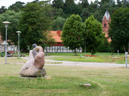 Sculpture in the park in front of the Church of St. Francis of Assisi (Former evangelical lutheran church) in Juodokrante in Lithuania.の写真素材