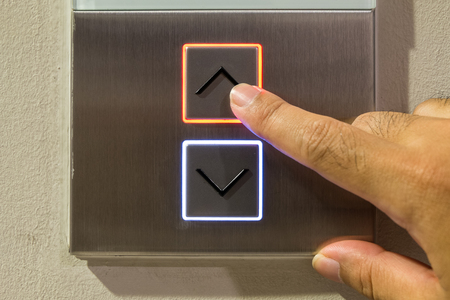 Elevator button with right handの写真素材