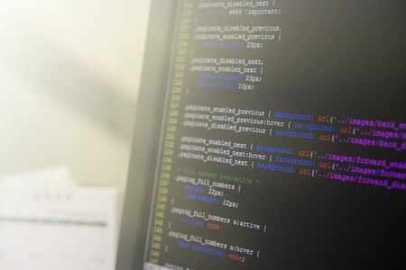 coding css on mornitor at the office - for background or montage product