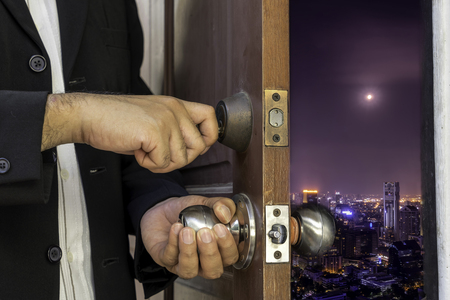 abstract concept of business man open the door to cityscape , open mind , unseen urban cityscapeの写真素材