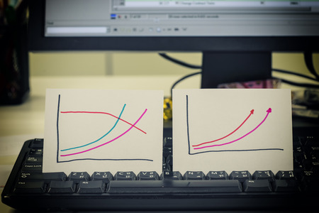 double manual graph on keyboard and monitor for show difference with vintage filter - can use to display or montage on productの写真素材