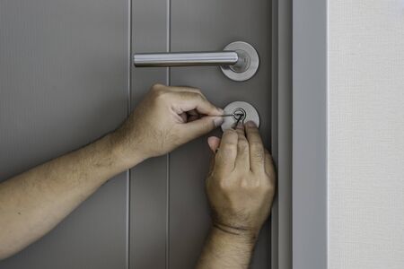 locksmith try to open the door by screwdriver - can use to display or montage on products