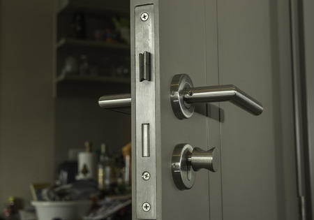 close-up the door face lock and silver handle in the room - can use to display or montage on productの写真素材
