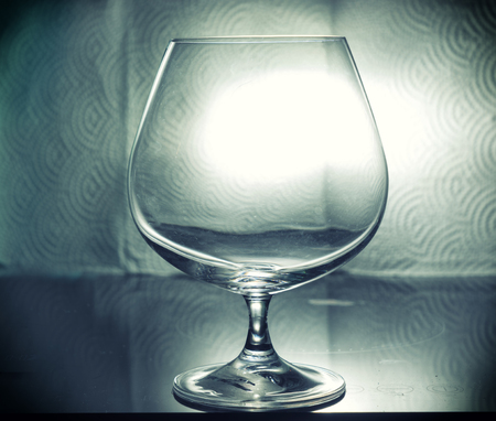 abstract single whisky glass on table and vintage filter - can use to display or montage on productsの写真素材