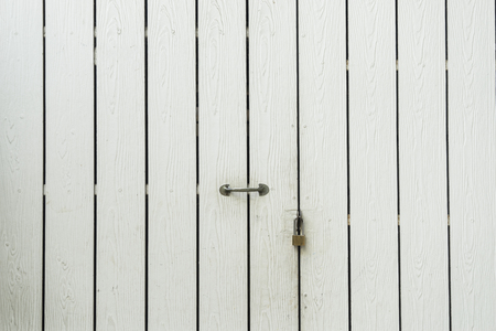 white wood door focus on lock for closed - can use to display or montage on productの写真素材