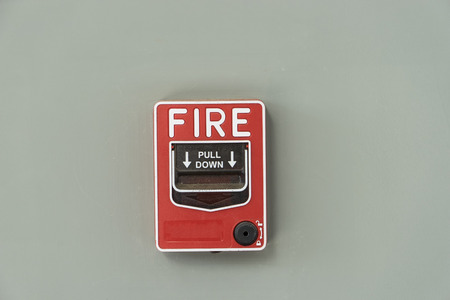 fire alarm notify isolate on gray wall - can use to display or montage on productの写真素材