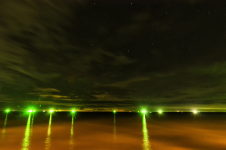 abstract noght seascape of green light and star - can use to display or montage on productの写真素材