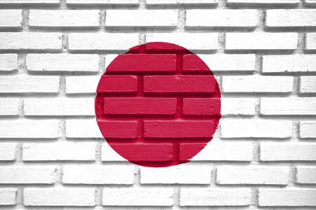 japan flag on brick wallの写真素材