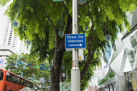 sign of use underpass for cross the road in singapore city - can use to display or montage on productの写真素材