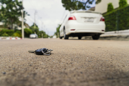 abstract car key fall on the cement ground - can use to display or montage on productの写真素材