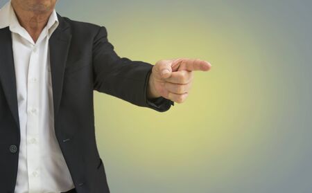 abstract old businessman point finger to ordering on blur background - can use to display or montage on productの写真素材