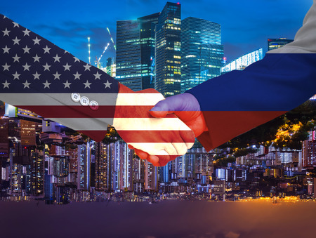 double exposure of handshake between USA and russia on double side cityscape background - can use to display or montage on productの写真素材