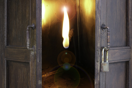 abstract old window open to frame of fire with lenfare filter - can use to display or montage on productの写真素材