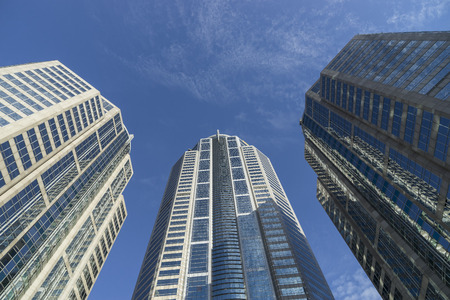 abstract building perspective on blue sky with clouds for background - can use to display or montage...
