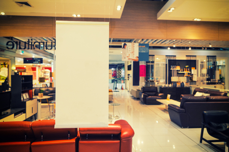 abstract white label free space for text on blur furniture store background with vintage filter - can use to display or montage on productの写真素材