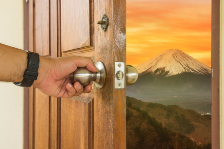 Abstract scene of man open the wood door to mount fuji in sun rise - can use to display or montage on productのeditorial素材