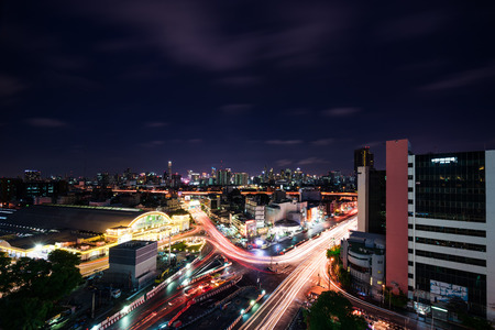 abstract night light tail and cityscape skyline - can use to display or montage on productのeditorial素材