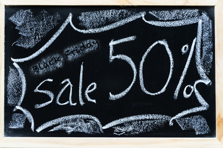 black friday sale on black chalkboard for promote to customer vintage posters design conceptの写真素材
