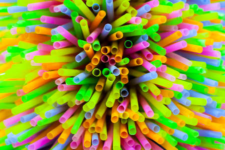 Colored plastic drinking straws focus on center pointの写真素材