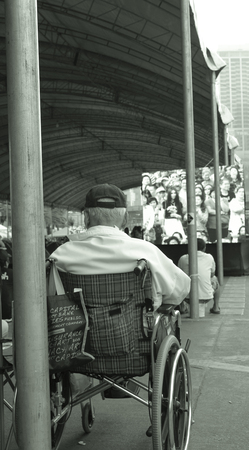 A man on  wheelchair listen leader talk about government  のeditorial素材