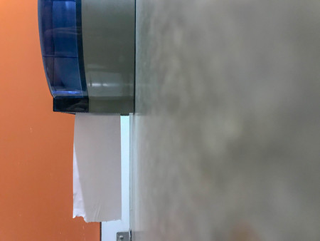 tissue paper out from block in toiletの写真素材
