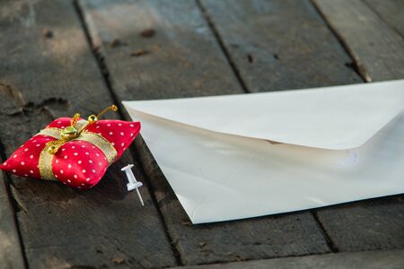 Wedding Invitation card crafting of cardboard lying on a woodenの写真素材