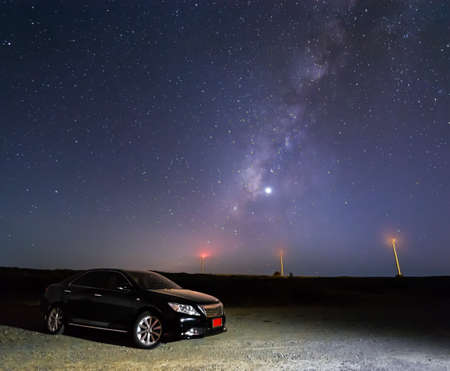 The car of the tourist against the star skyの写真素材