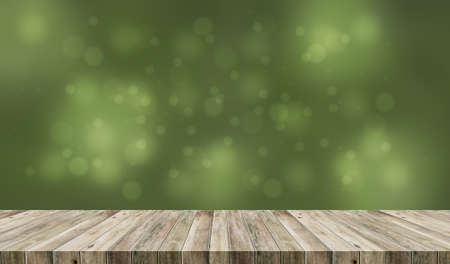 wooden deck table with green blurred background.