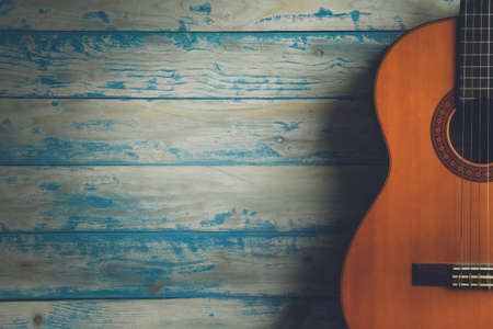 Acoustic guitar on wood background.vintage filter effectの写真素材