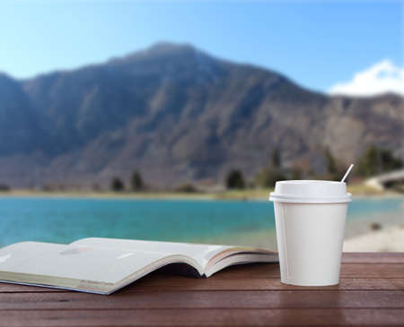 paper coffee cup on wooden tableの写真素材