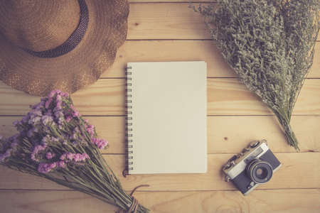 Open notebook on wooden tableの写真素材