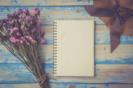 Open notebook on wooden tableの写真素材