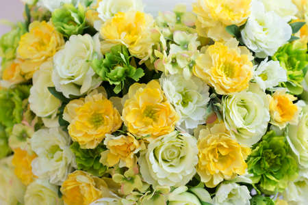 Beautiful artificial flowers on white backgroundの写真素材