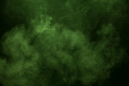 Green smoke on black background.の写真素材