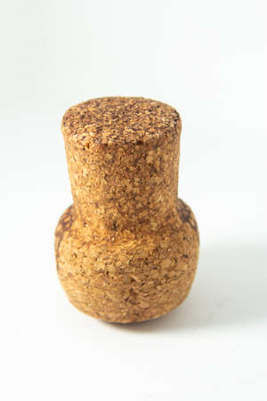 Wine cork isolated on white background Wine cork isolated on white background. Collection of vintage wooden cork with red and beige wine details. Texture of wine vine close-up. Wine cellar with a corkの写真素材