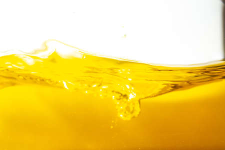 Water wave with bubble of air, on white background. Yellow waterの写真素材