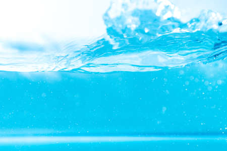Water wave with bubble of air, on white background. Blue waterの写真素材