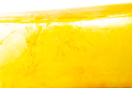 Water wave with bubble of air, on white background. Yellow waterの写真素材